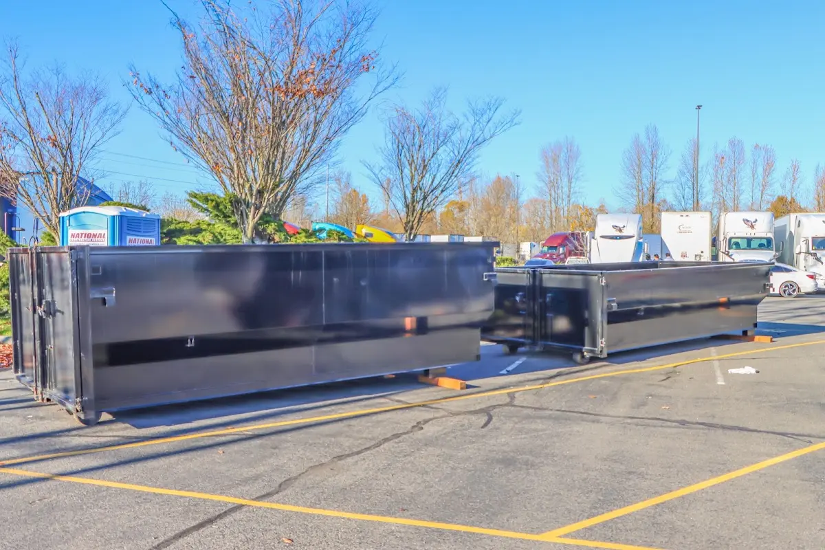 Professional dumpster rental service with roll-off container on residential driveway in Ladera Ranch